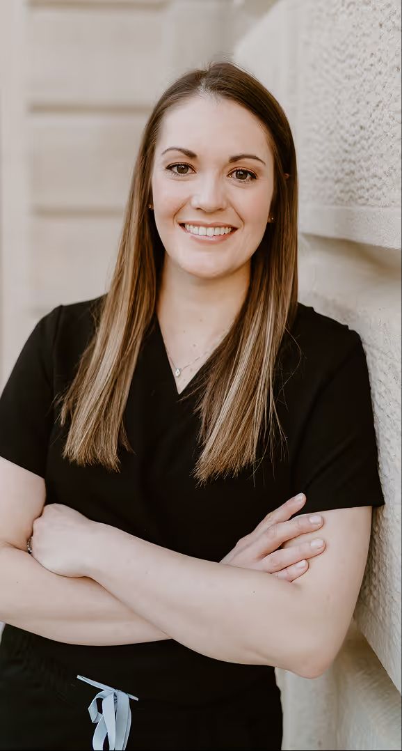 Dr. Heather Triggs in black scrubs with her arms crossed