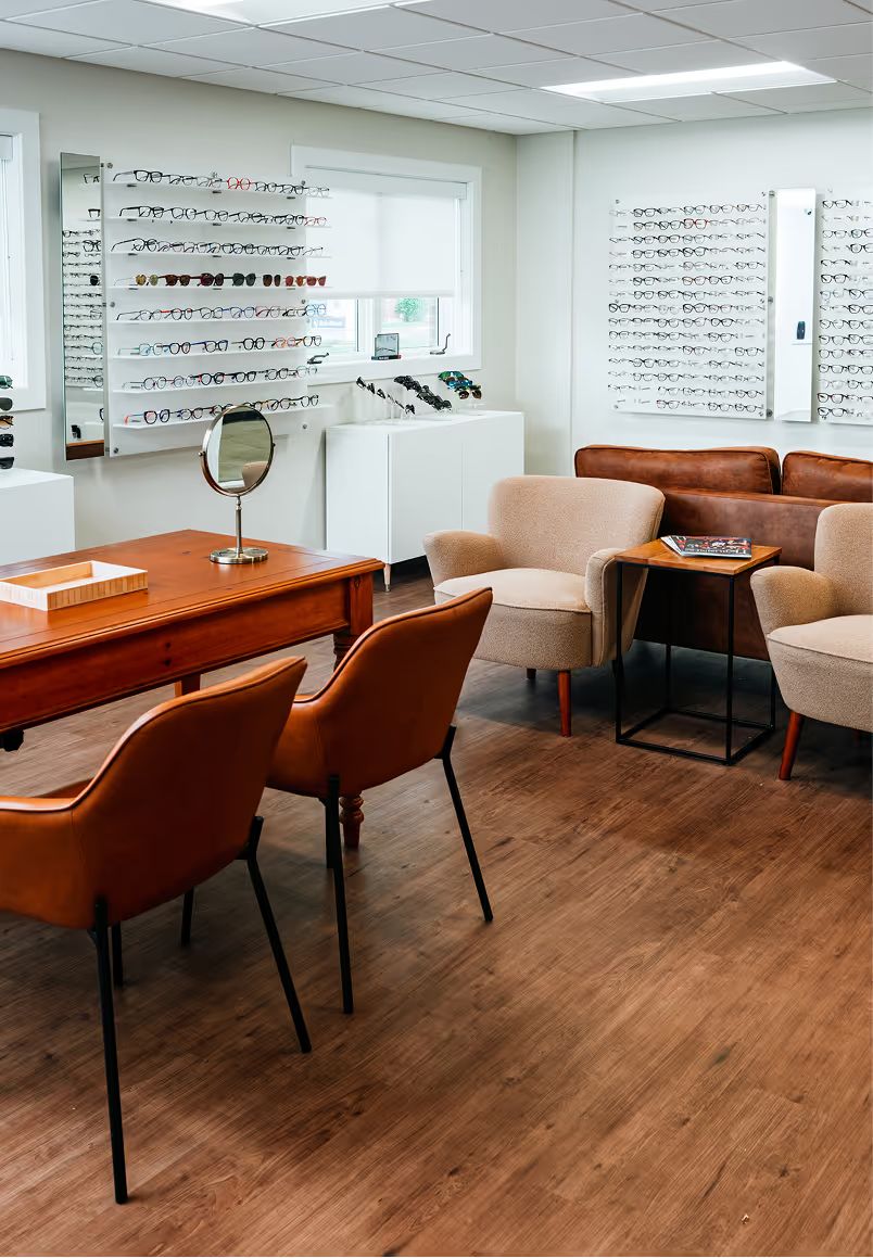 Crystal Vision office with a seating area and walls of eyeglass frames
